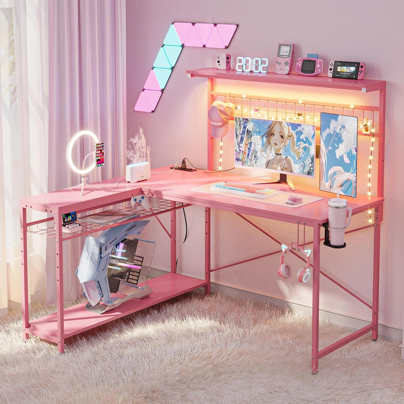 Bestier L Shaped Gaming Desk with Power Outlets, 51 Inch LED Computer Desk Reversible Corner Desk with Metal Grid Pegboard and 4 Tiers Storage Shelves, Modern Writing Desk for Home Office, Pink