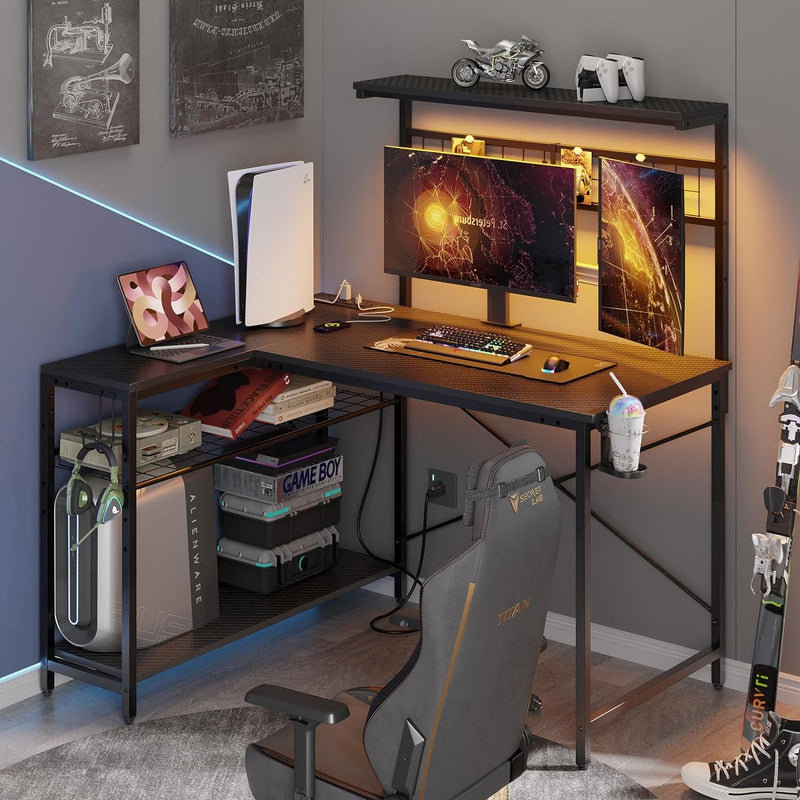 Bestier Gaming Desk with Power Outlets,42 Computer Desk with LED Lights, Reversible Corner Desk with 4-Tier Shelves,Cup Holder & Hook for Home Office,Carbon Fiber Black