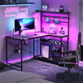 Bestier Gaming Desk with Power Outlets,42 Computer Desk with LED Lights, Reversible Corner Desk with 4-Tier Shelves,Cup Holder & Hook for Home Office,Carbon Fiber Black