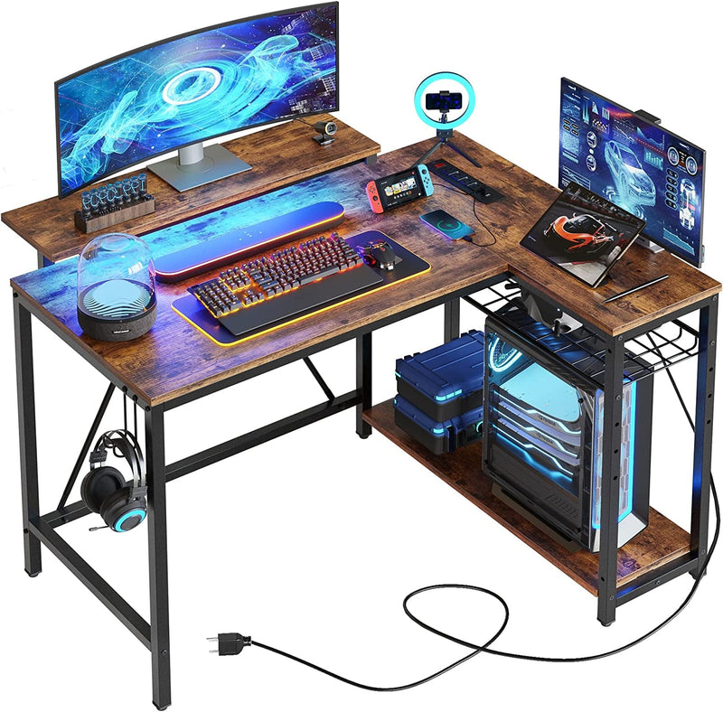 Bestier Gaming Desk with Power Outlets,42 LED Small Corner Computer Desk with Reversible Storage Shelves,L Shaped Desk with Hooks Workstation Desk for Office and Bedroom,Pink Carbon Fiber