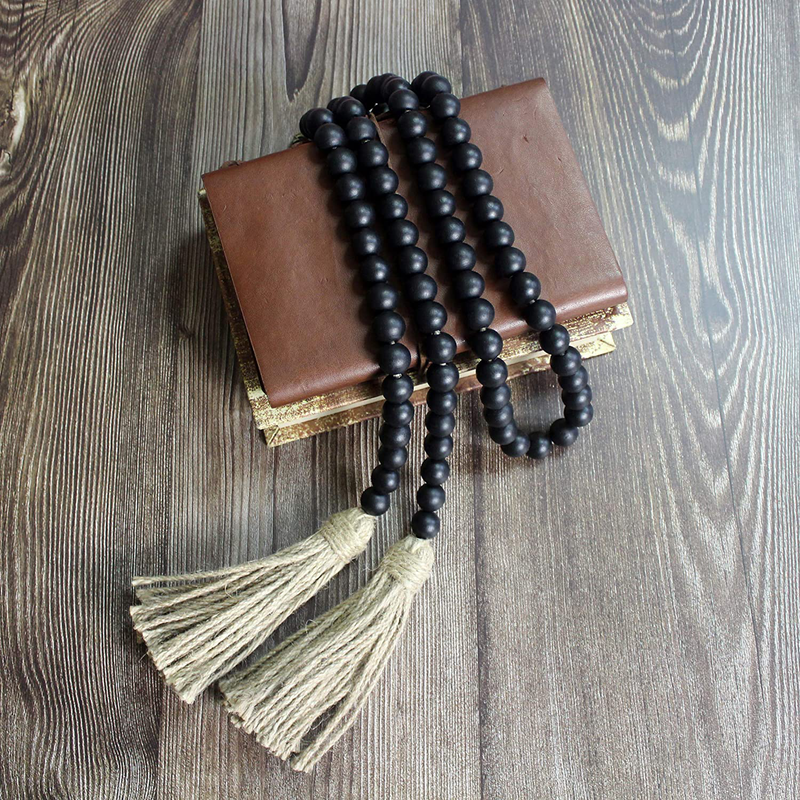 CVHOMEDECO. Wood Beads Garland with Tassels Farmhouse Rustic Wooden Prayer Bead String Wall Hanging Accent for Home Festival Decor. Black