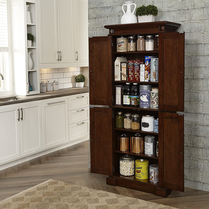 Home Styles Freestanding Americana Kitchen Pantry in Cherry Finish Constructed of Hardwood Solids with Four Storage Doors, Four Adjustable Shelves