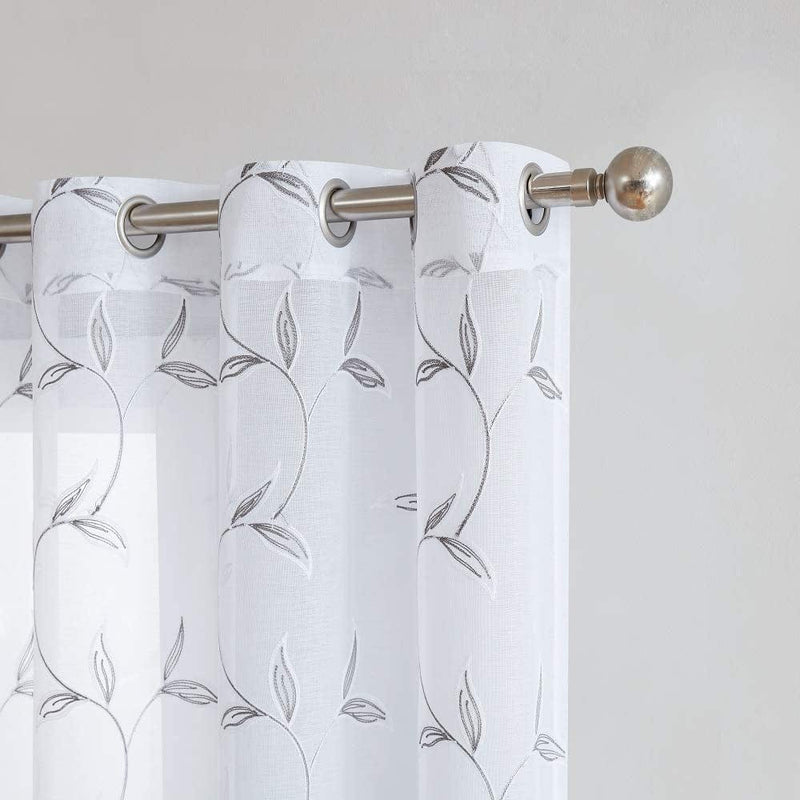 Warm Home Designs Pair of 2 Sheer White Faux-Linen Short Size Curtain Panels with Beautiful White Color Stitched Leaf Embroidery. Each Grommet Drape Is 54" (Width) X 63" (Length). M White 63" Home & Garden > Decor > Window Treatments > Curtains & Drapes Warm Home Designs Charcoal Leaves 2 Panels: 54" x 72" Each 